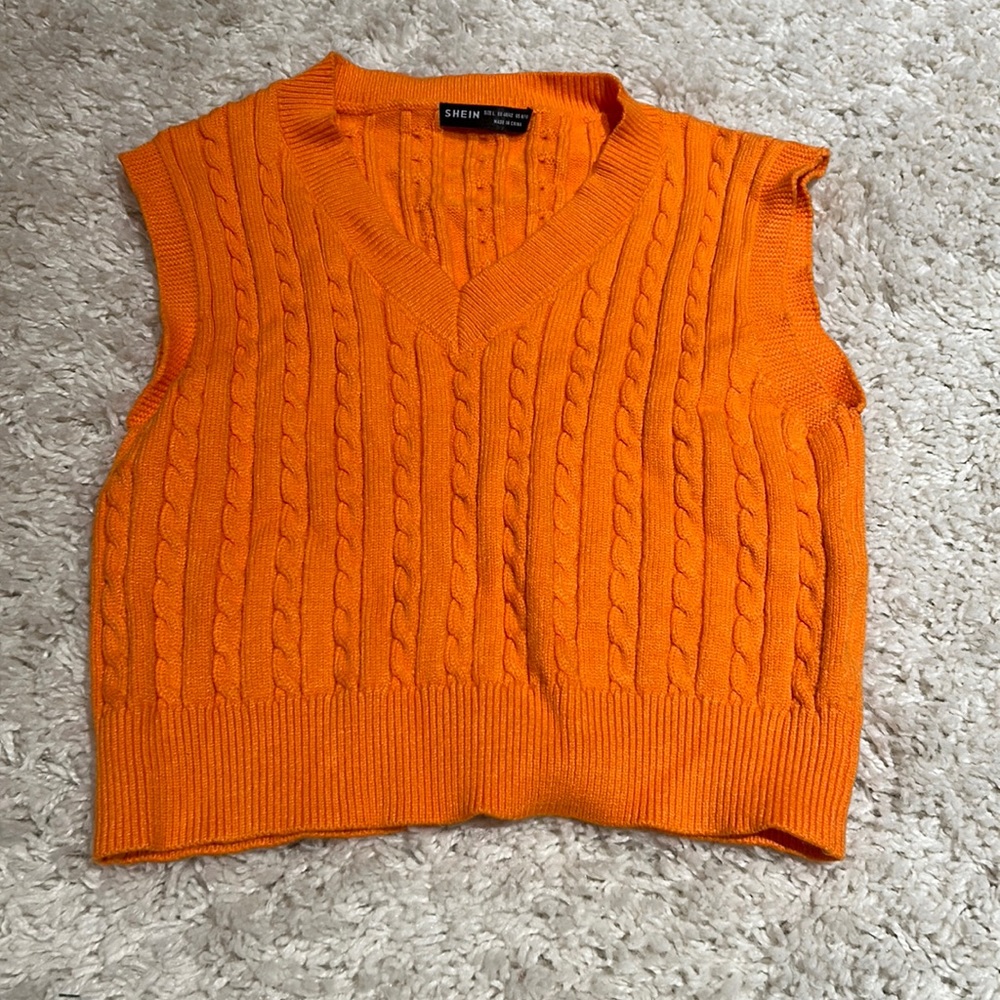 bright orange sweat vest
